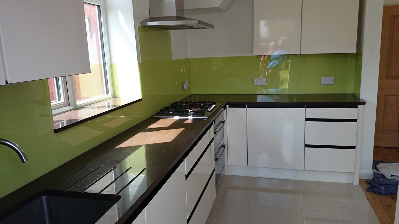 Lime green glass kitchen splashback installed by Harlesden glaziers